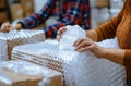 People wrapping items in bubble wrap Royalty Free Stock Photo