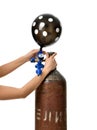 Hands inflate black dotted balloon use Helium Tank with Economy Regulator Fill Valve Royalty Free Stock Photo