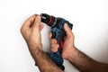 Hands inserting drill bit into drill chuck Royalty Free Stock Photo