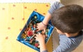 Hands inside a box of sweets. Caucasian child catching candy.