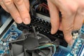 Hands installing computer parts