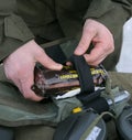 Hands of instructing officer holding first-aid kit pack showing its content Royalty Free Stock Photo