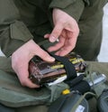 Hands of instructing officer holding first-aid kit pack showing its content Royalty Free Stock Photo