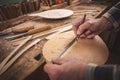 Instrument maker working with his hands