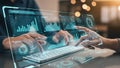 Hands using a futuristic transparent tablet displaying financial data and charts image photo Royalty Free Stock Photo