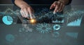 Hands interacting with futuristic digital interface displaying financial data and charts Royalty Free Stock Photo