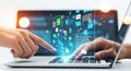 Hands interacting with futuristic digital interface on a laptop screen showcasing data and applications Royalty Free Stock Photo