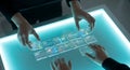 Hands interacting with futuristic transparent cards on a glowing interactive table Royalty Free Stock Photo
