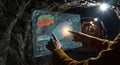 Tech-Savvy Miner Operating Holographic Interface in Underground Mine for Efficient Resource Extraction Royalty Free Stock Photo