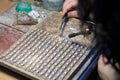 Hands of jeweller at work silver soldering Royalty Free Stock Photo