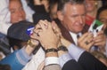 Hands join for Governor Bill Clinton during a Denver campaign rally in 1992 on his final day of campaigning in Denver, Colorado