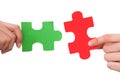 Hands joining jigsaw puzzle pieces Royalty Free Stock Photo