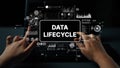 Hands on Keyboard with Digital Data Lifecycle Graphics Representing Information Flow and Management in Modern Technology Royalty Free Stock Photo
