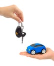 Hands with keys and toy car Royalty Free Stock Photo