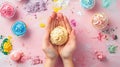 Hands knead soft cookie dough before baking, ready to decorate with colorful icing