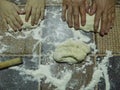 Hands kneading bread dough