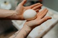 hands kneading bread dough on a cutting board. knead the pizza dough. ball of dough in male hands Royalty Free Stock Photo