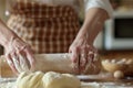 Hands kneading dough, rolling pin for dough, bakery and bakehouse