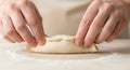 Hands Kneading Dough on White Surface Royalty Free Stock Photo