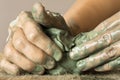 Hands kneading raw blue clay Royalty Free Stock Photo