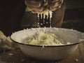 Hands kneading sauerkraut - salty cabbage juice is dripping down