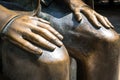 Hands on knees sculpture - bronze statue Royalty Free Stock Photo