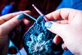 Hands Knitting / crocheting granny squares Royalty Free Stock Photo