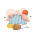 Hands knitting scarf of woolen threads