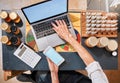 Hands, laptop and honey with a retail woman checking her phone while working at a desk in her store. Computer, ecommerce Royalty Free Stock Photo