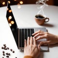 hands on laptop keyboard with cofee cup on white table Royalty Free Stock Photo