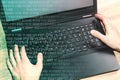 Hackers laptop with binary code. Royalty Free Stock Photo