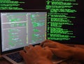 Hands on laptop keyboard. Man on coding. Cybersecurity.