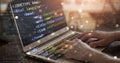 hands on laptop programming web coding