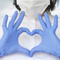 Hands in latex glove shows the symbol of the heart. Doctor for the heart. Love our medical professionals Royalty Free Stock Photo