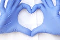 Hands in latex glove shows the symbol of the heart. Doctor for the heart. Love our medical professionals Royalty Free Stock Photo