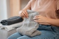 Hands, laundry and towel for woman, home or spring cleaning on living room sofa for hygiene. Cleaner, maid and cotton Royalty Free Stock Photo