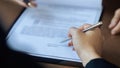 Hands of lawyer pointing at paper for businessperson signing contract. Solicitor, legal advisor helping mature client to Royalty Free Stock Photo