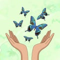 Hands, let out blue beautiful butterflies. On a green background. Vector illustration Royalty Free Stock Photo