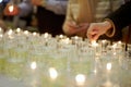 Hands lighting funeral candles Royalty Free Stock Photo