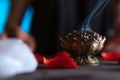 Hands lighting an incense, cleansing ritual, spiritual beliefs, white magic