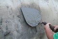 Hands of a little boy with building trowel Royalty Free Stock Photo
