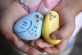 Hands of a Little Child Holding Friendship Rocks Painted like Happy Colorful Birlds Royalty Free Stock Photo