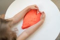 Hands little girl make heart from kinetic sand.development of fine motor skills Royalty Free Stock Photo