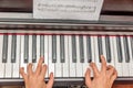 Hands of a little girl playing the piano Royalty Free Stock Photo