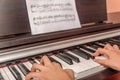 Hands of a little girl playing the piano Royalty Free Stock Photo