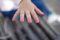 hands of a little girl who has painted her fingernails alone