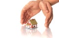 Hands and little house. Royalty Free Stock Photo