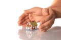 Hands and little house. Royalty Free Stock Photo