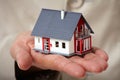 Hands with little house. Royalty Free Stock Photo