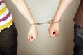 Hands locked with handcuffs Royalty Free Stock Photo